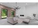 Bright living room with fireplace, sleek furniture, and large windows with a view at 538 Main St, Palmetto, GA 30268