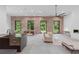 Open concept living space with brick accent wall, neutral furniture, and modern finishes at 538 Main St, Palmetto, GA 30268