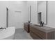 Modern main bathroom featuring double sink vanity, standing tub, and neutral paint scheme at 538 Main St, Palmetto, GA 30268
