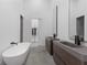 Main bathroom showcasing a standing tub, double vanity, and walk-in closet at 538 Main St, Palmetto, GA 30268