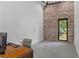 Office space featuring a vintage desk and exposed brick wall at 538 Main St, Palmetto, GA 30268