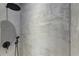 Main bathroom shower with artistic cement design and overhead shower head at 538 Main St, Palmetto, GA 30268