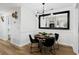 Inviting dining area with modern decor, a large mirror, and a round table at 107 Barrington Hills Dr, Atlanta, GA 30350