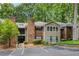 Attractive condo building with brick accents and well-maintained landscaping at 107 Barrington Hills Dr, Atlanta, GA 30350