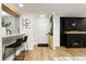 Bright living room featuring a fireplace, light floors, and modern decor at 107 Barrington Hills Dr, Atlanta, GA 30350