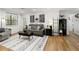 Bright living room featuring a comfortable sofa, stylish decor, and natural light at 107 Barrington Hills Dr, Atlanta, GA 30350