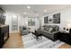 Cozy living room with comfortable seating, stylish decor, and ample lighting at 107 Barrington Hills Dr, Atlanta, GA 30350