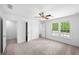 Bedroom showcasing a ceiling fan, carpet, and ample closet space at 191 High Creek Dr, Roswell, GA 30076