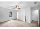 Bright bedroom with a ceiling fan, carpet, and neutral walls at 191 High Creek Dr, Roswell, GA 30076