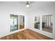 Bright dining area featuring wood-look flooring, white walls, and sliding glass doors to the outside at 191 High Creek Dr, Roswell, GA 30076