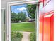 Inviting view through the front door to the well-maintained front yard and neighborhood at 191 High Creek Dr, Roswell, GA 30076