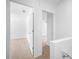 Bright hallway with white walls and carpet at 191 High Creek Dr, Roswell, GA 30076