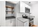 Well-equipped kitchen with stainless steel appliances, including a gas range and microwave at 191 High Creek Dr, Roswell, GA 30076