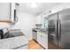 Modern kitchen featuring stainless steel appliances, granite countertops, and ample cabinet space at 191 High Creek Dr, Roswell, GA 30076