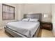 Bedroom with a gray bed, window, and hardwood floors at 195 14Th Ne St # 1501, Atlanta, GA 30309