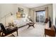Cozy living room features a comfortable sofa, stylish decor, and natural light from the window at 195 14Th Ne St # 1501, Atlanta, GA 30309