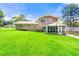Traditional brick home featuring a well-maintained lawn and a screened-in porch perfect for enjoying the outdoors at 2117 Chestnut Hill Circle Cir, Decatur, GA 30032