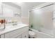 Bathroom featuring vanity with sink and shower over tub with glass door at 2117 Chestnut Hill Circle Cir, Decatur, GA 30032