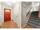 Entryway with hardwood floors, a wooden front door, and carpeted stairs at 2117 Chestnut Hill Circle Cir, Decatur, GA 30032