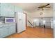 Bright kitchen with blue cabinets, and a view to the upstairs living room at 2117 Chestnut Hill Circle Cir, Decatur, GA 30032