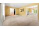 Spacious living room with yellow walls, white trim, and a view into dining room at 2117 Chestnut Hill Circle Cir, Decatur, GA 30032
