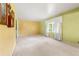 Spacious living room with yellow walls, a large window, and plush carpeting at 2117 Chestnut Hill Circle Cir, Decatur, GA 30032
