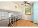 Cozy loft area featuring wood floors, railing, ceiling fan and natural light at 2117 Chestnut Hill Circle Cir, Decatur, GA 30032