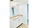 This bathroom boasts a granite countertop, a sink, and white cabinets at 238 Walker Sw St # 22, Atlanta, GA 30313