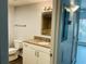 This is a bathroom with a granite countertop, mirror, and white cabinets at 238 Walker Sw St # 22, Atlanta, GA 30313