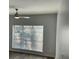 A sunlit bedroom with wood-look flooring and a modern ceiling fan at 238 Walker Sw St # 22, Atlanta, GA 30313