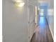 Hallway with wood floors, overhead lighting, and storage closets at 238 Walker Sw St # 22, Atlanta, GA 30313