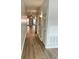 Hallway features wood-look flooring, storage closets, and contemporary wall sconces at 238 Walker Sw St # 22, Atlanta, GA 30313