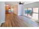 Open concept living area with light wood flooring, ceiling fan, large window and open floorplan at 238 Walker Sw St # 22, Atlanta, GA 30313