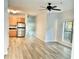 Open concept living area with light wood flooring, ceiling fan, window and stainless steel appliances at 238 Walker Sw St # 22, Atlanta, GA 30313