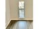Image of a room with wood-look flooring and window providing natural light at 238 Walker Sw St # 22, Atlanta, GA 30313