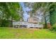 A wide shot of the backyard with a gray deck at 446 Jaywood Dr, Stone Mountain, GA 30083