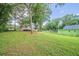 The spacious backyard features lots of trees and grass at 446 Jaywood Dr, Stone Mountain, GA 30083
