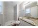 Bathroom features include a new shower, granite countertop, sink, mirror, and toilet at 446 Jaywood Dr, Stone Mountain, GA 30083