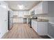Bright kitchen featuring white cabinets, stainless steel appliances, and stone countertops perfect for cooking at 446 Jaywood Dr, Stone Mountain, GA 30083