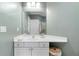 Bright bathroom with a white vanity, neutral wall color, and framed mirror at 719 Mcgill Park Ne Ave, Atlanta, GA 30312