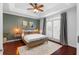 Stylish bedroom with tray ceiling, hardwood floors, and access to a balcony at 719 Mcgill Park Ne Ave, Atlanta, GA 30312