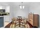 Cozy dining area featuring a glass table with 4 chairs and hardwood floors at 719 Mcgill Park Ne Ave, Atlanta, GA 30312