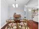 Cozy dining area featuring a glass table with 4 chairs and hardwood floors at 719 Mcgill Park Ne Ave, Atlanta, GA 30312