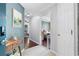 Inviting entryway with tiled floors, wall art, and view into the living room and bedroom at 719 Mcgill Park Ne Ave, Atlanta, GA 30312