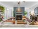 Relaxing living room with a fireplace, ample natural light, and hardwood floors at 719 Mcgill Park Ne Ave, Atlanta, GA 30312