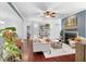 Cozy living room with a fireplace, hardwood floors, and neutral color scheme at 719 Mcgill Park Ne Ave, Atlanta, GA 30312