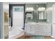 Bright bathroom with dual sinks, soaking tub, and updated fixtures at 719 Mcgill Park Ne Ave, Atlanta, GA 30312