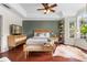 Spacious main bedroom with hardwood floors, tray ceiling, and large windows at 719 Mcgill Park Ne Ave, Atlanta, GA 30312