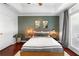 This bedroom features a tray ceiling, stylish decor, and a door to the outside at 719 Mcgill Park Ne Ave, Atlanta, GA 30312