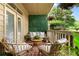 This patio space has outdoor seating and a privacy wall for an inviting experience at 719 Mcgill Park Ne Ave, Atlanta, GA 30312